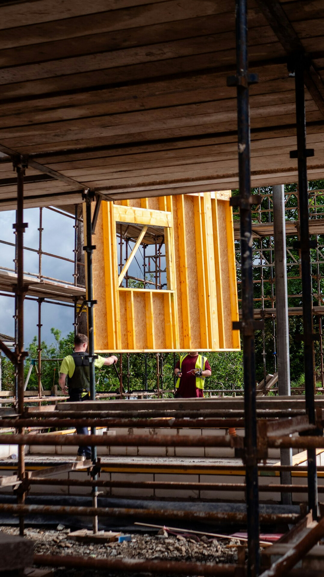 construction workers repairing house