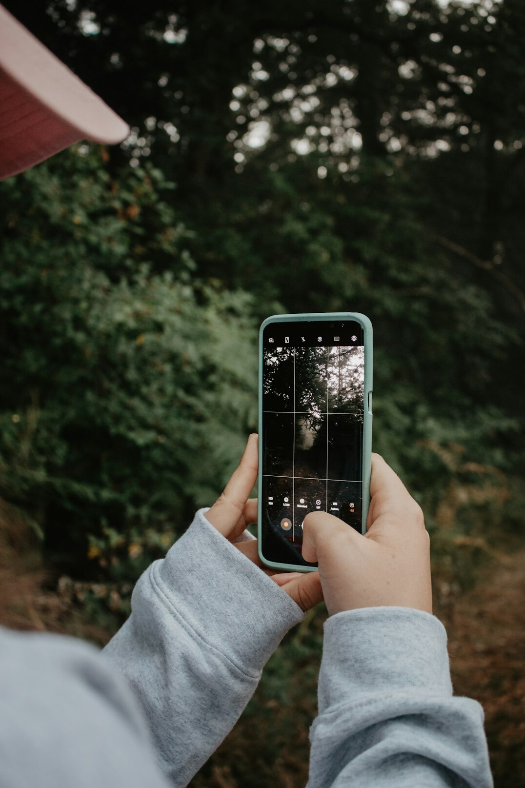 person taking photos of damage